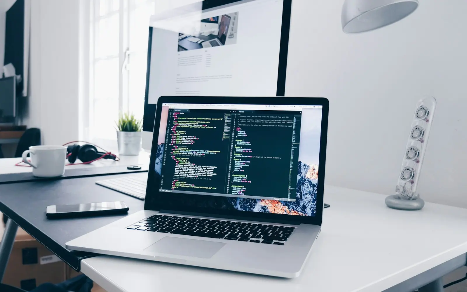 Developer workspace showing modern website code on a laptop