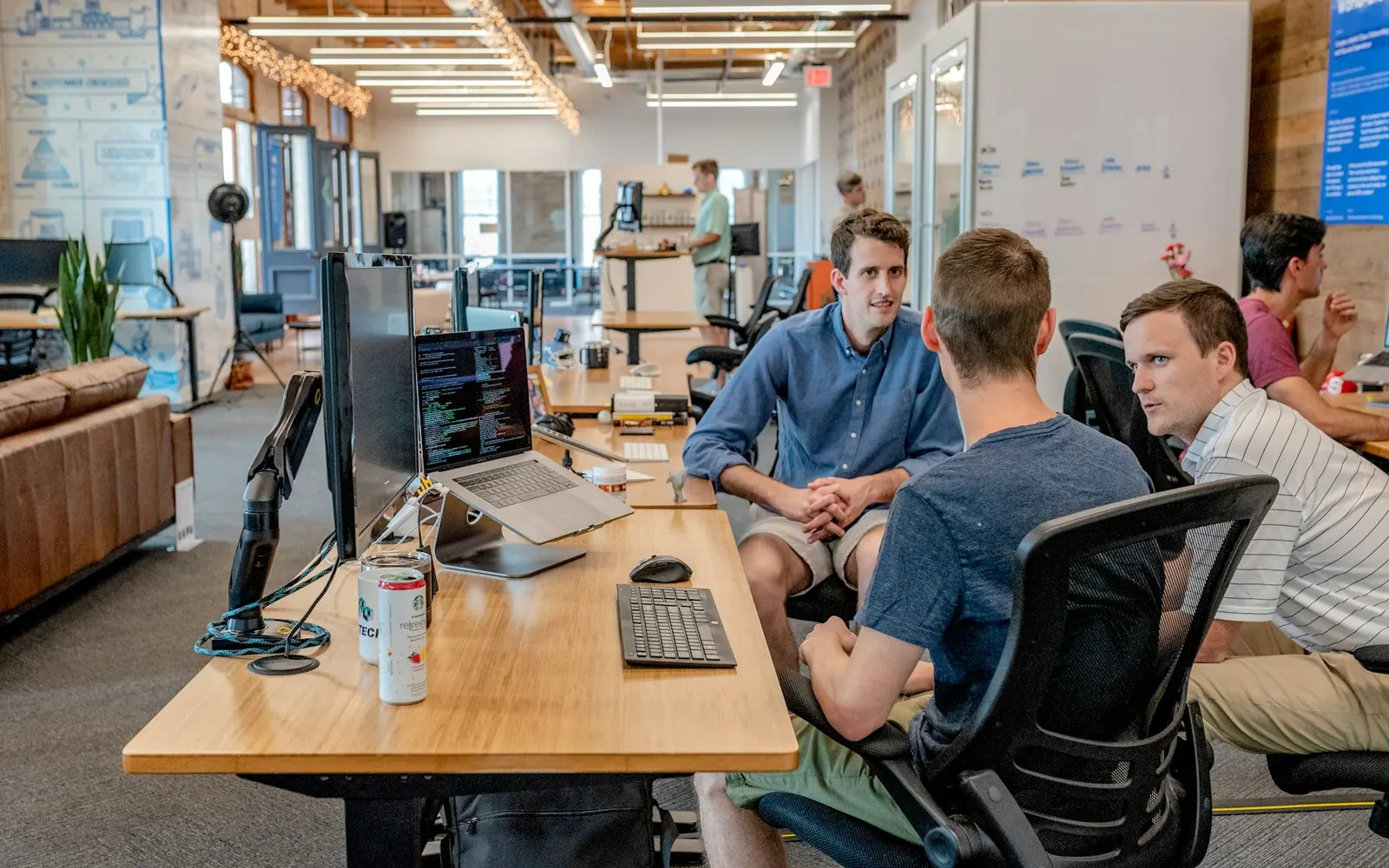 Hybrid office team collaborating around a table